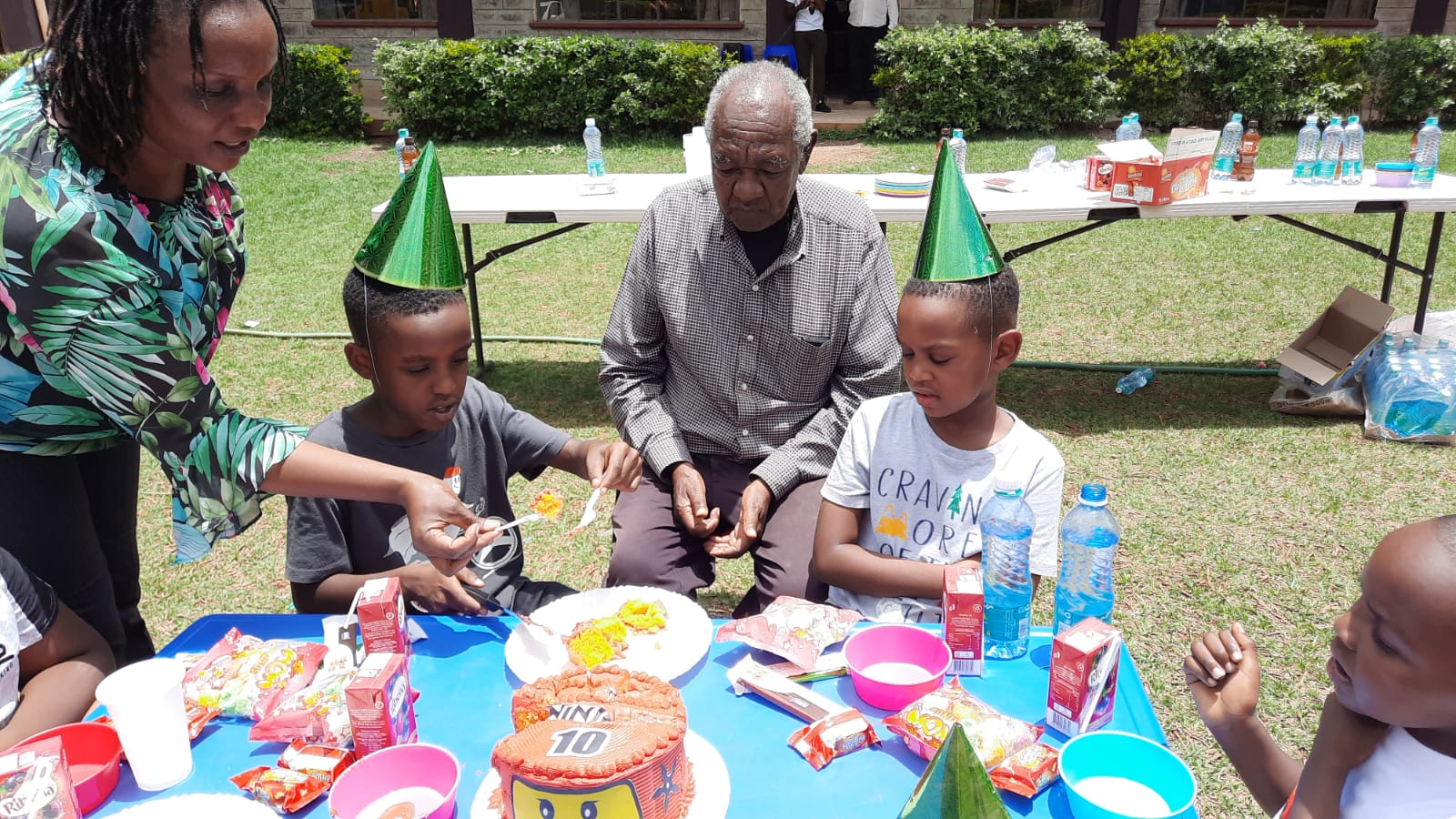 Clement at birthday with grandchildren