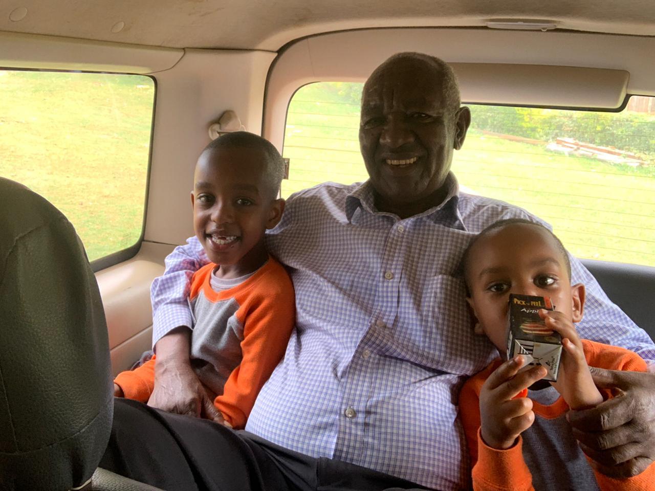 Clement in car with grandchildren