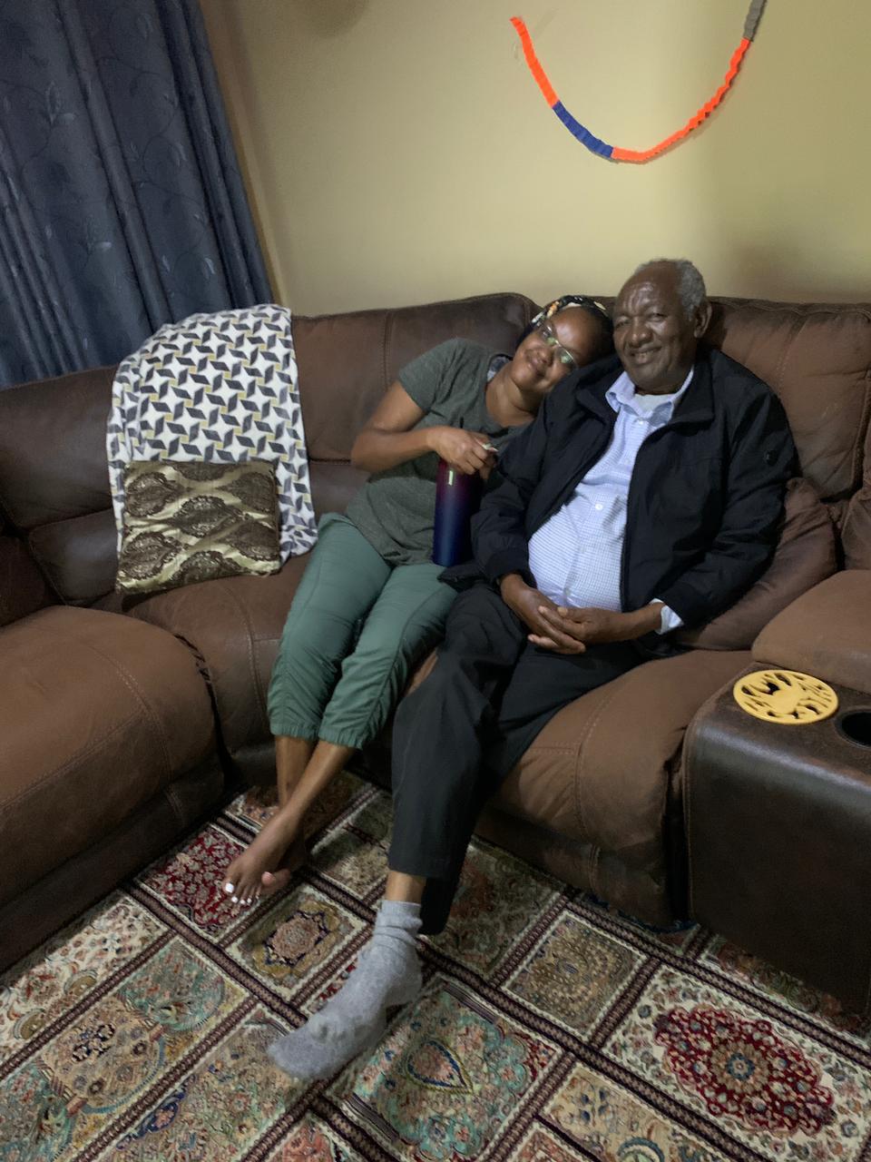 Clement with daughter on sofa
