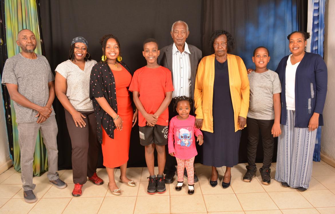 Clement with large family portrait