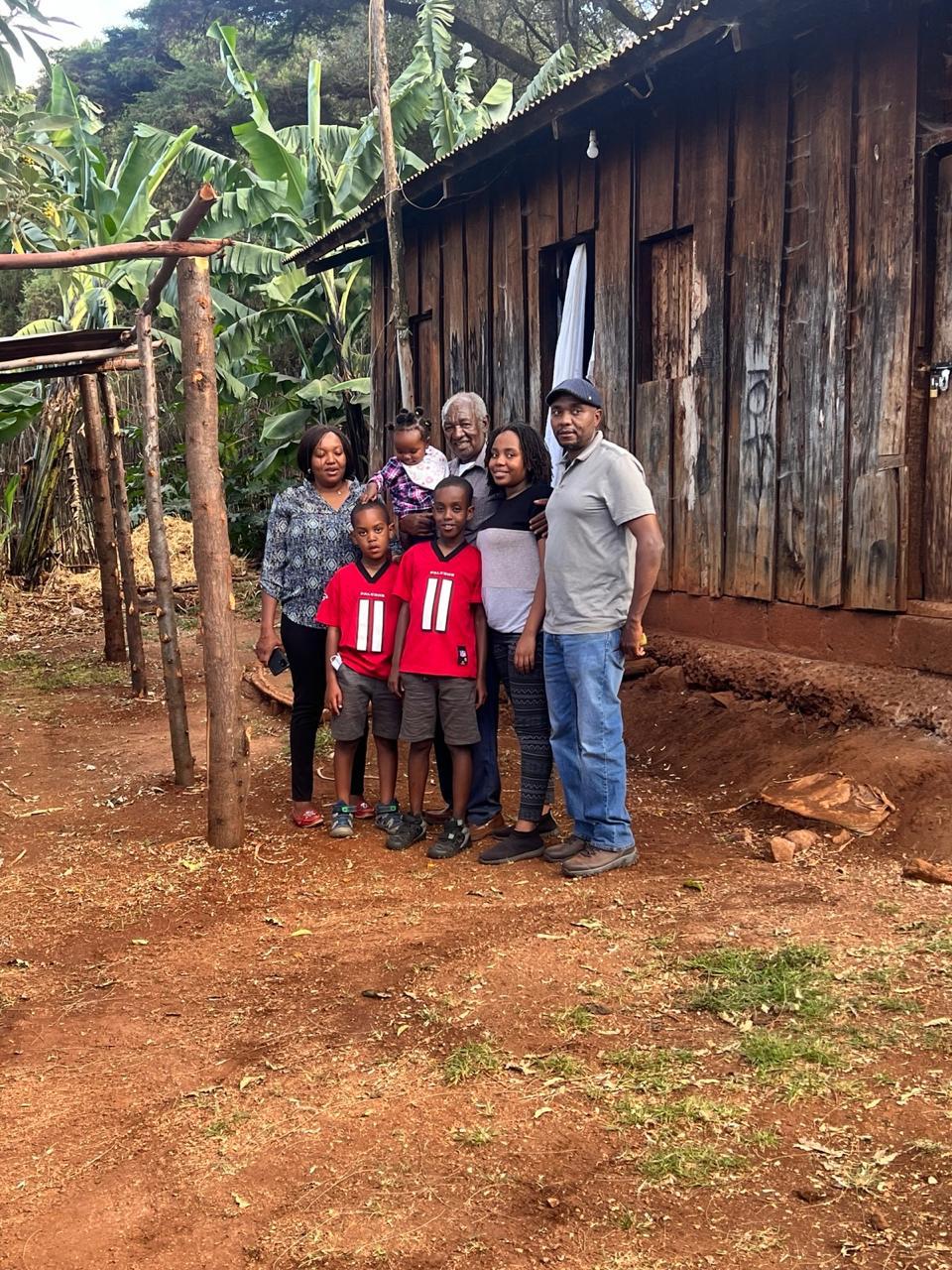Clement at old homestead with family